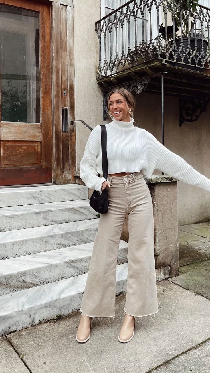 white sweater with beige wide-leg pants and beige boots